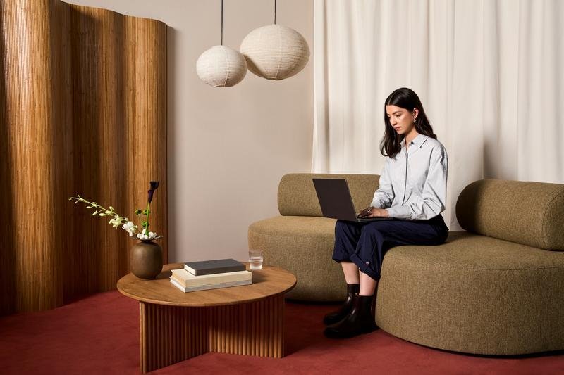 A web designer looking at her laptop