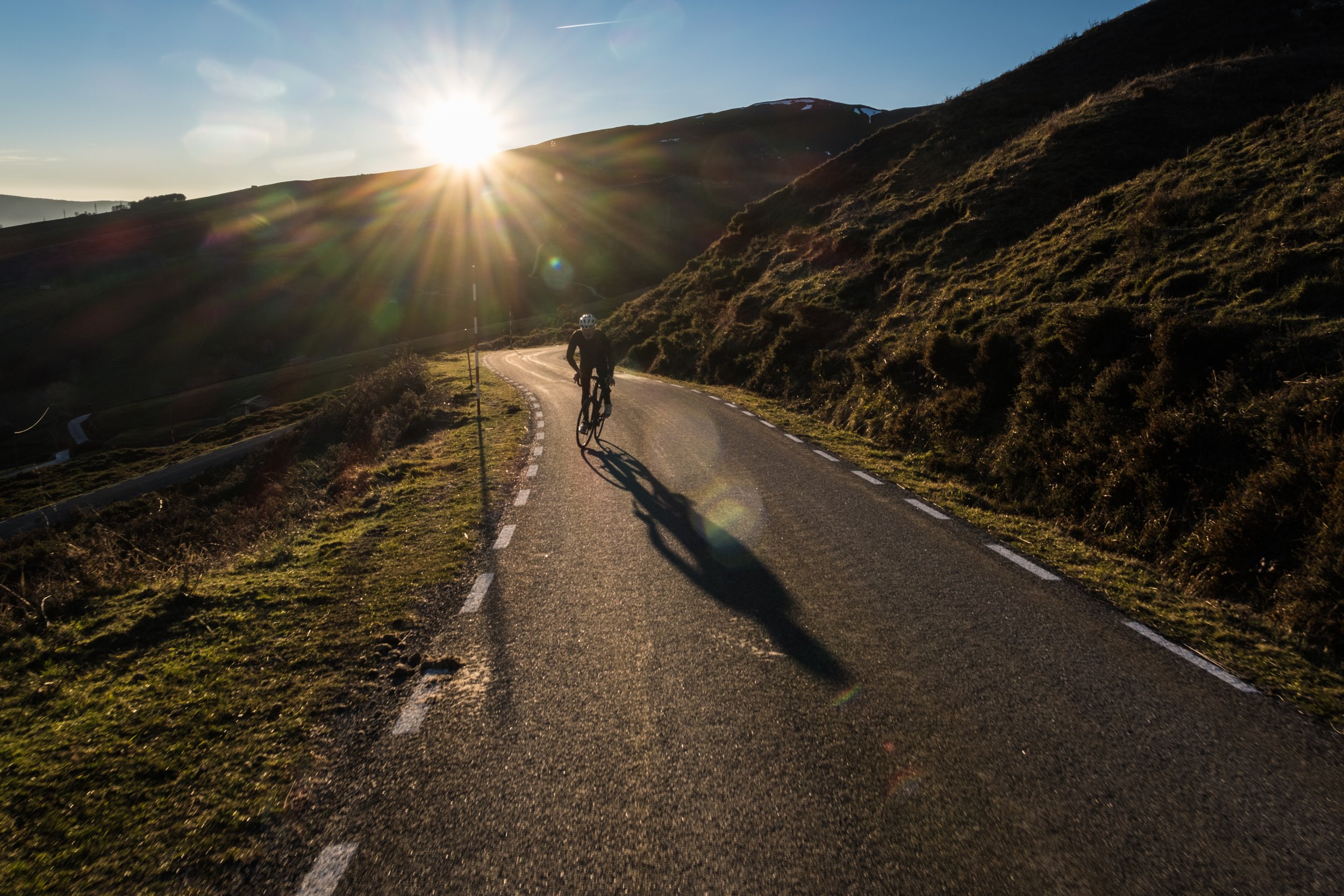 Solo cyclist climbs a hill