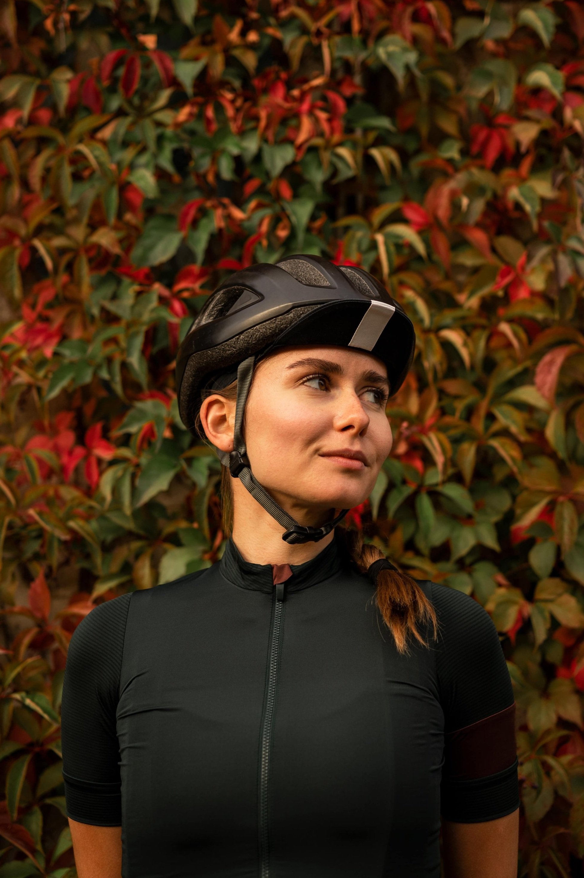 Female cyclist wearing helmet