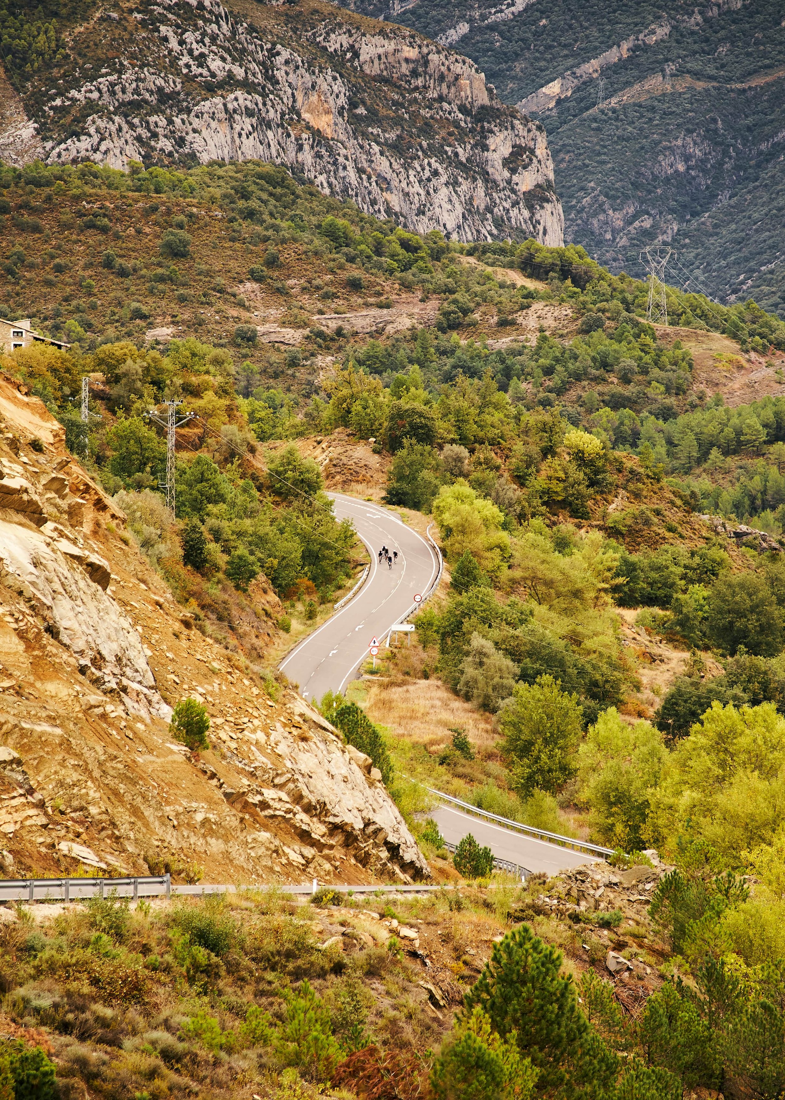 Cyclists on a winding mountain road